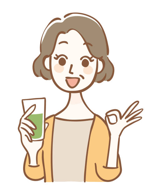 Middle-aged woman holding green juice and OK pose Middle-aged woman holding green juice and OK pose mature woman healthy eating stock illustrations