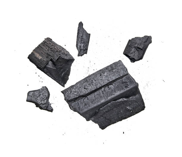 istock Black charcoal isolated on white background 1304152635