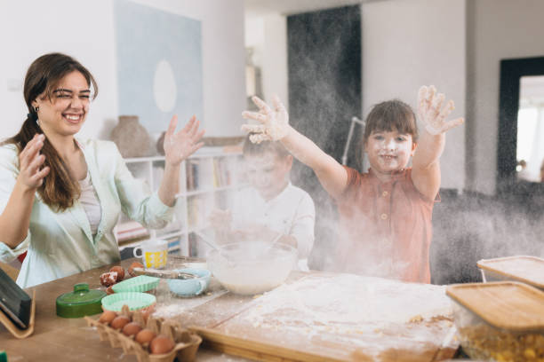 istock mother and kids baking at home 1304153748