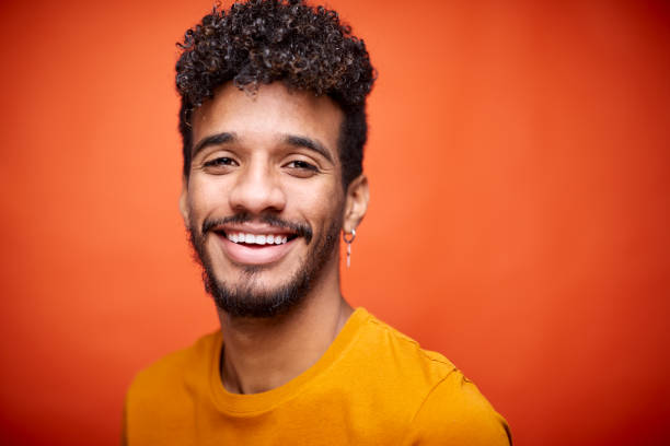 istock Young man smiling at the camera. 1304153904