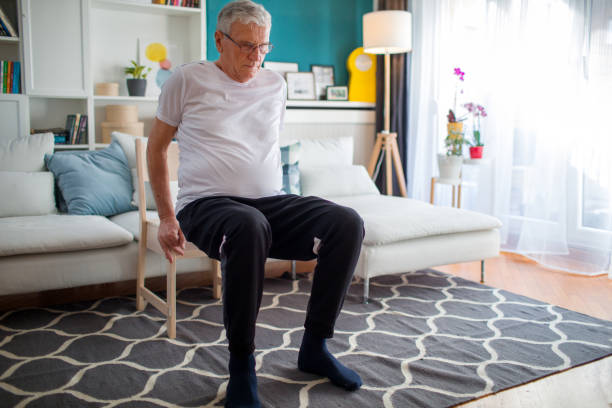 Senior Man Exercising At Home Without Traditional Equipment
