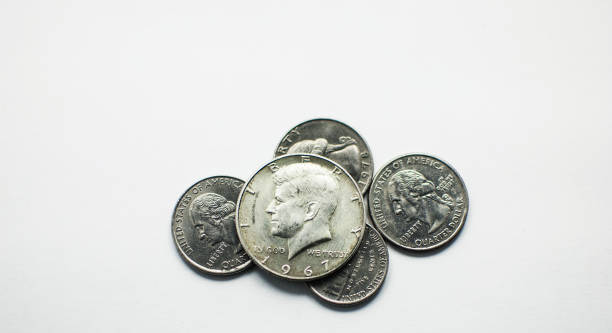 istock US silver coin half dollar Kennedy on quarter pile 1304162679