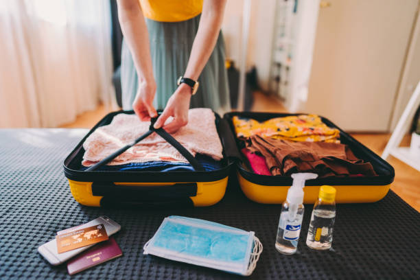 istock Packed suitcase for business travel after COVID-19 1304164730