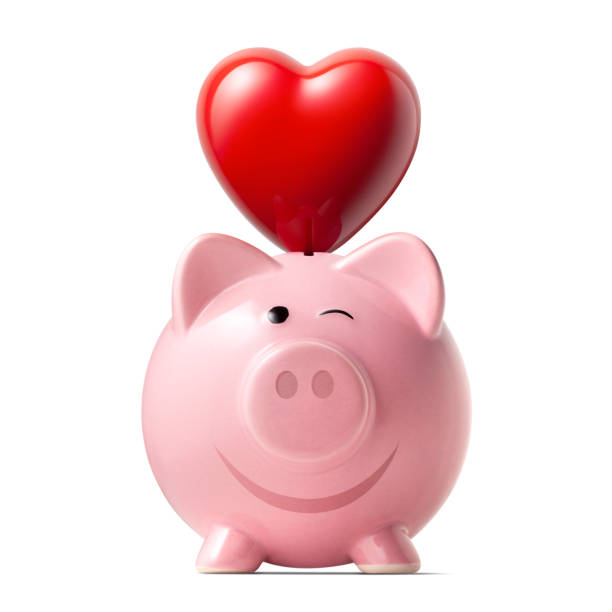 Piggy bank with human heart and metal US dollar symbol on black background