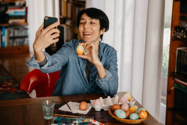 istock Woman takes a selfie with painted Easter eggs 1304165624