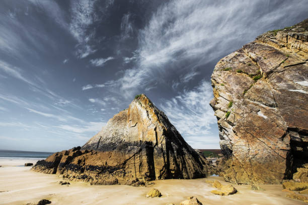 istock A huge block of rock on a beach 1304165850