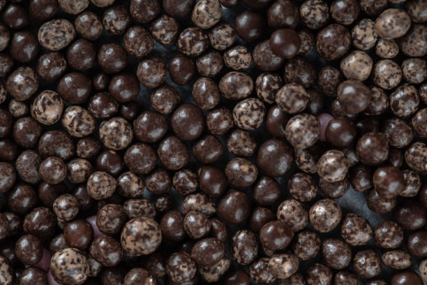 istock Bunch of chocolate drop candies background 1304168046