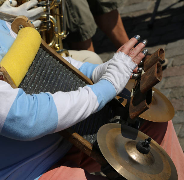 istock musician playing a self-made instrument with thimbles to rub aga 1304169445