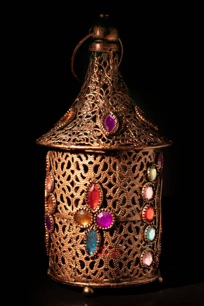 istock Old bronze arabic lamp isolated on black 1304170563