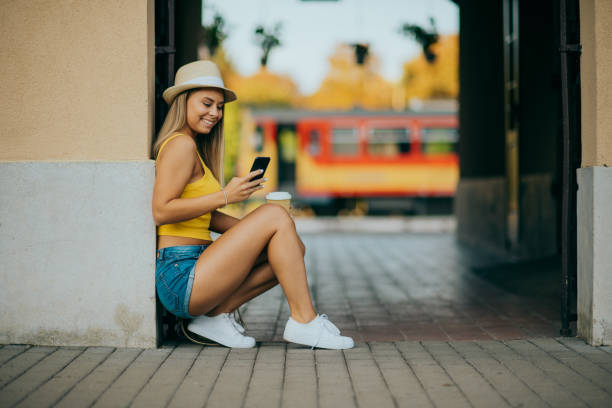 istock young girl waiting for the train in summer 1304171062