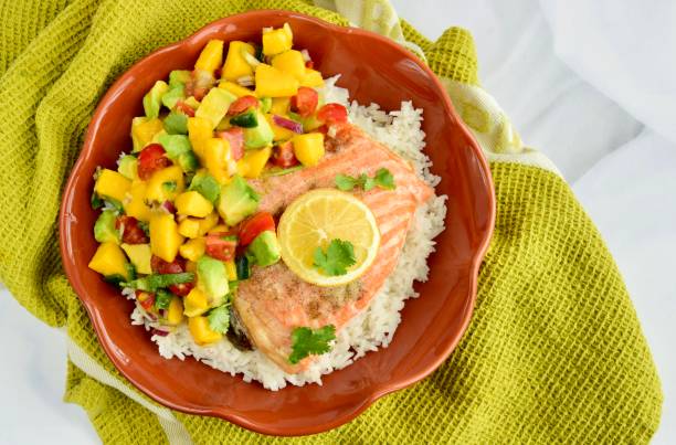 istock Baked salmon with coconut rice and mango avocado salsa 1304171924