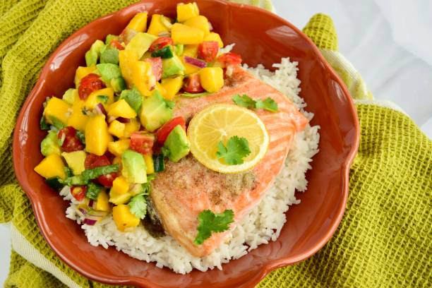 istock Baked salmon with coconut rice and mango avocado salsa 1304171928