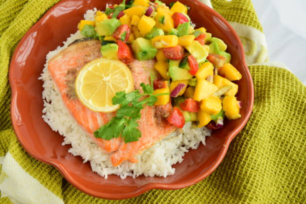 istock Baked salmon with coconut rice and mango avocado salsa 1304171933