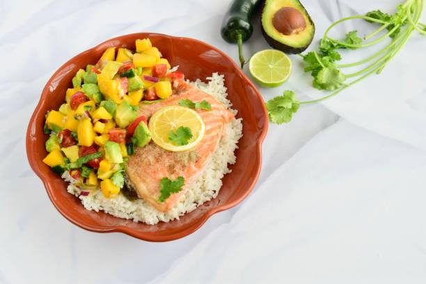 istock Baked salmon with coconut rice and mango avocado salsa 1304171935