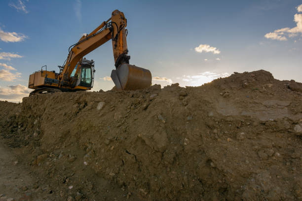 istock Excavator moving dirt and sand at a construction site 1304172111