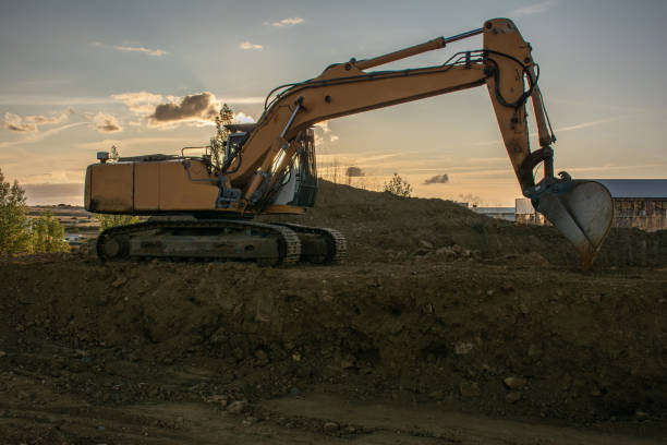 istock Excavator moving dirt and sand at a construction site 1304172113