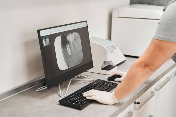 istock Dentist looking at the patient his x-ray of teeth 1304174477