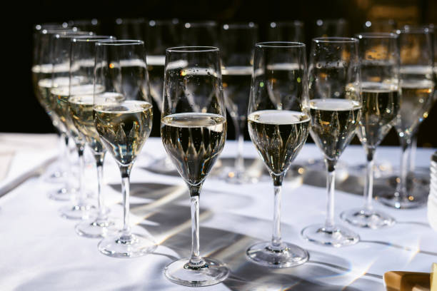 istock Set or row glasses of wine on the table before reception or wedding party 1304175925
