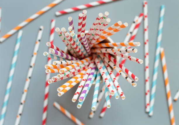 istock Striped and dotted paper drinking straws top view 1304177191