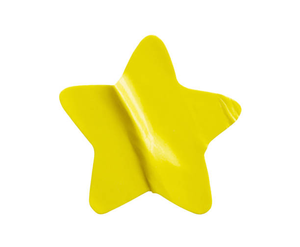 Yellow star shape paper sticker label isolated on white background