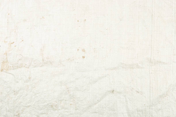 istock Dirty white woven plastic bag texture background. 1304182418