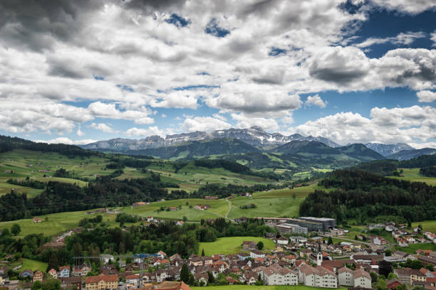 Waldstatt with mount Säntis in the background Waldstatt is a city in the canton Appenzell Ausserrhoden in Switzerland. Mount Säntis is the highest mountain in the Appenzell Alps Alpstein with 2504 meters over sea. Travel destinations. appenzell stock pictures, royalty-free photos & images