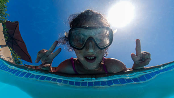 istock Little girl on a poolside. View from below. 1304190259