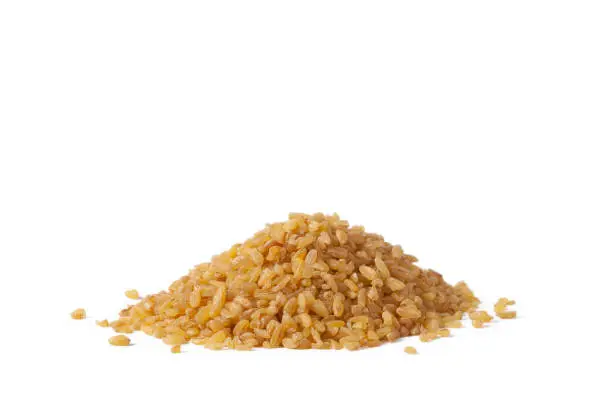 A small slide of dry bulgur on the table.