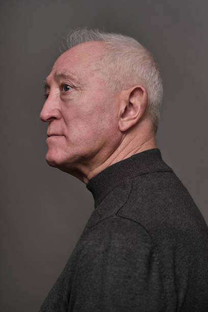 One senior man cut-out studio formal portrait.