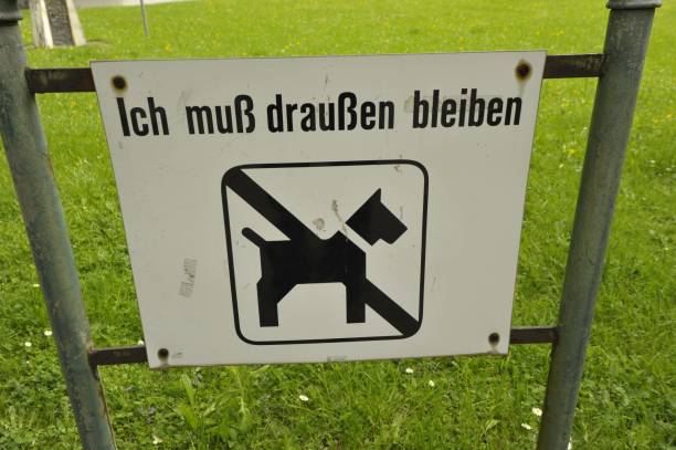 a no dogs allowed sign, ban of dogs in a specific area
