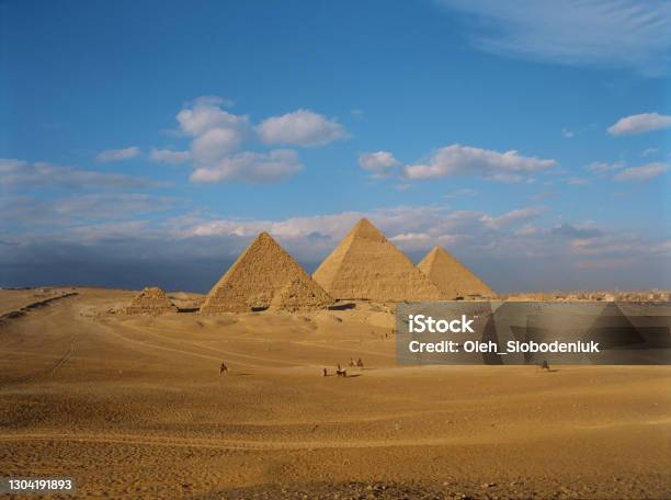 Scenic View Of Giza Pyramids At Sunset Stock Photo - Download Image Now - Pyramid, Pyramid Shape, Giza Pyramids