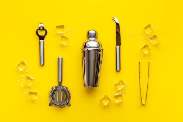 istock Set of cocktail drink tools and ingredients with shaker and ice. Flat lay 1304193034