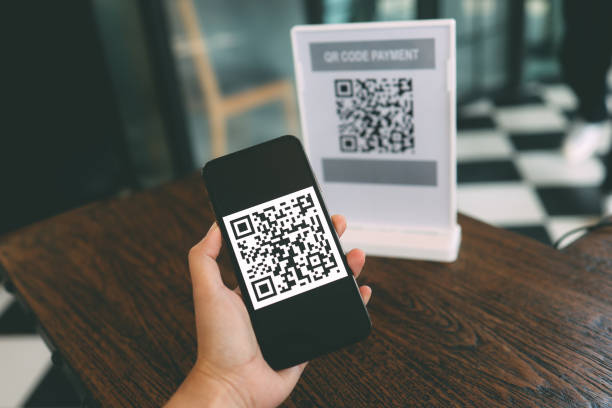 istock Qr code payment. E wallet. Man scanning tag accepted generate digital pay without money.scanning QR code online shopping cashless payment and verification
technology concept 1304194163