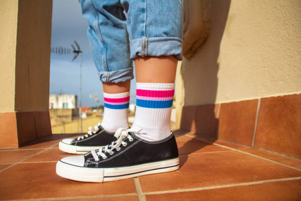 istock Woman with bisexual flag on her socks 1304195717