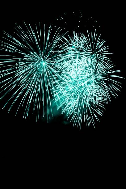 istock Luxury fireworks event sky show with turquoise big bang stars 1304196650