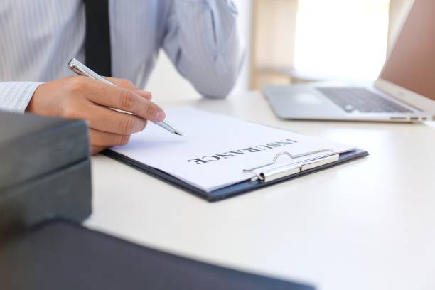 istock Sales manager giving advice application form document, considering mortgage loan offer for car and house insurance. 1304196857
