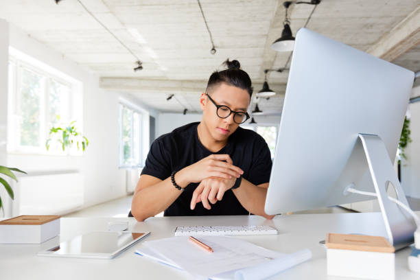 istock Handsome asian man working in the creative workplace 1304197548