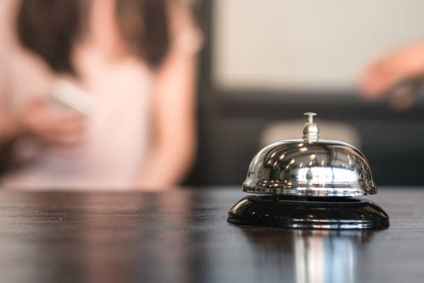 istock Hotel reception counter desk with service bell. 1304198060
