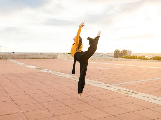 istock Young beautiful ballerina posing on tiptoe 1304198155