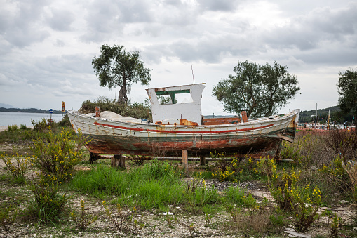 An old boat lies ashore