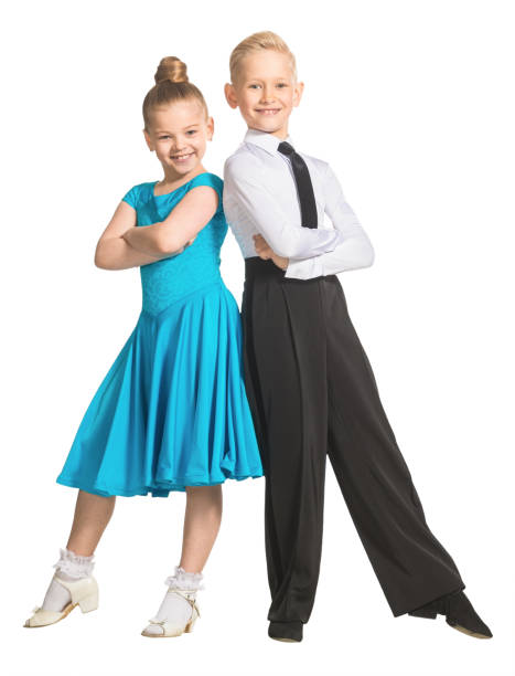 Sports ballroom dancing. Couple of kids, boy and girl  on isolated white background Sports ballroom dancing. Couple of dancers, boy and girl in costumes for ballroom dancing. Isolate teenager couple child blond hair stock pictures, royalty-free photos & images