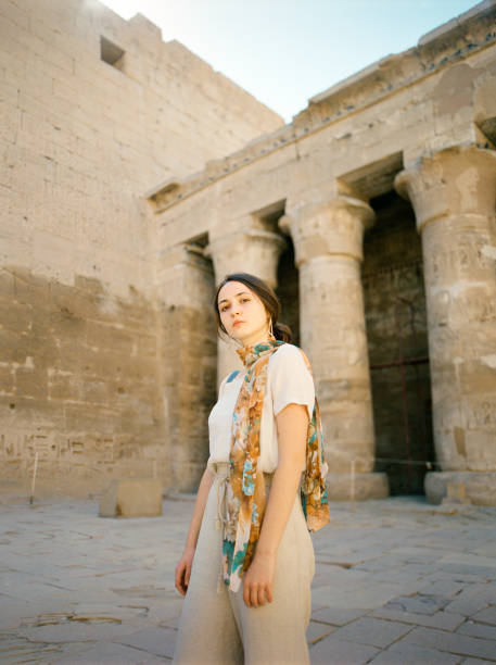 istock Woman walking in the ancient Egyptian temple in Luxor 1304201780