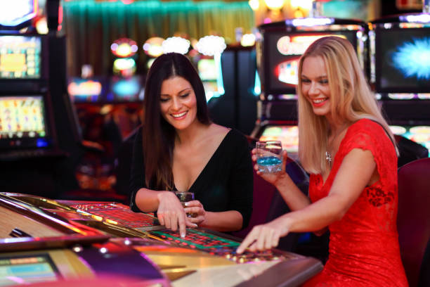 istock Female friends enjoying the automatic roulette 1304201983