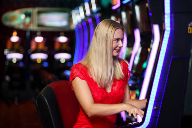 istock Woman on slot machines 1304201997
