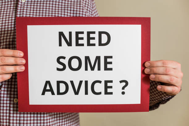 istock Man holding paper with text need some advice 1304205501