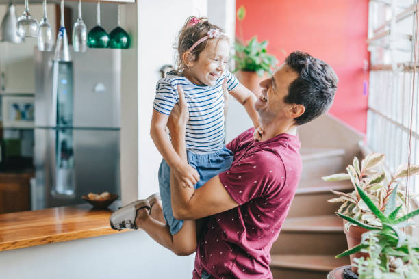 istock Father and daughter having fun at home 1304209477