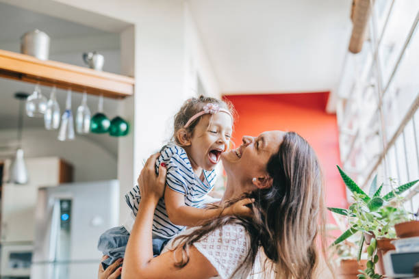 istock Mother and daughter having fun at home 1304209496