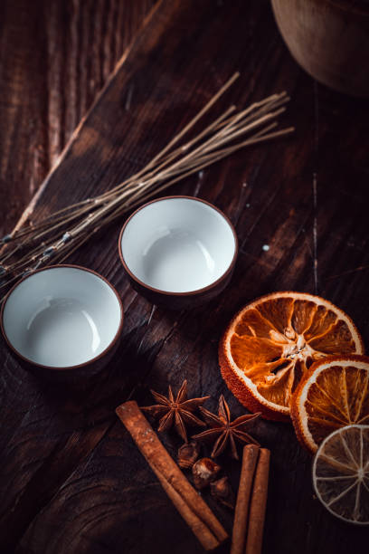 istock Ceramic cups with herbs for Chinese tea ceremony on dark background. 1304209520