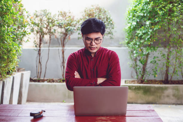 istock An Asian man is working on a laptop and is devoted to planning the work. Successful businessmen Business and team work concept 1304209719