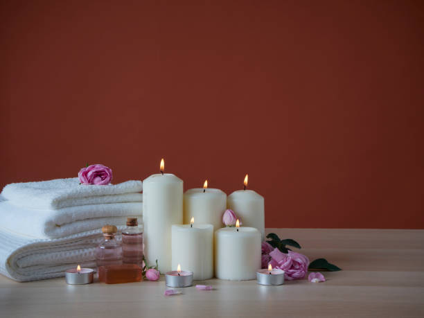 istock Spa composition with aroma oil and burning candles on table 1304210364